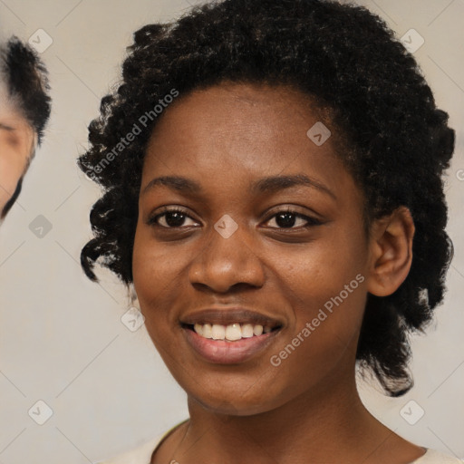 Joyful black young-adult female with medium  black hair and brown eyes