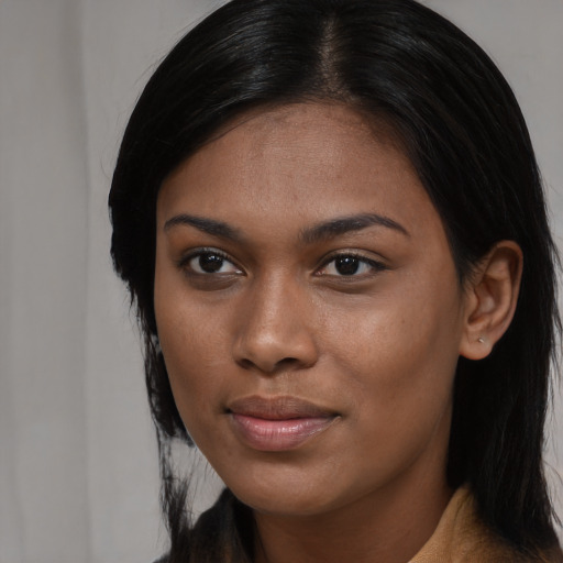 Joyful asian young-adult female with long  brown hair and brown eyes
