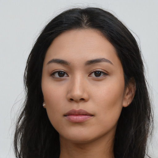 Neutral latino young-adult female with long  black hair and brown eyes
