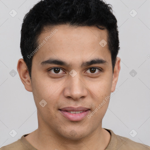 Joyful latino young-adult male with short  brown hair and brown eyes