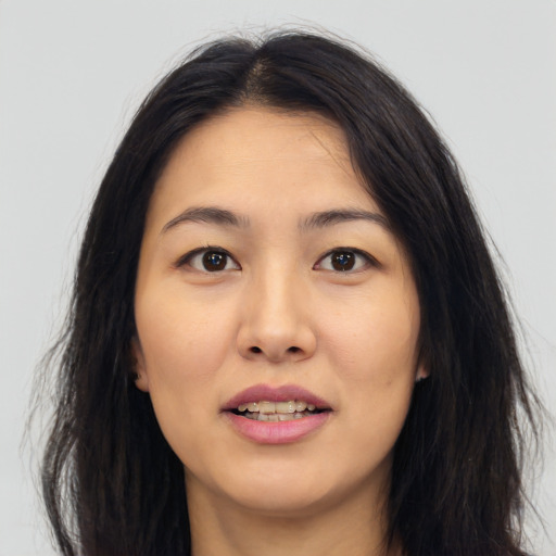 Joyful white young-adult female with long  black hair and brown eyes