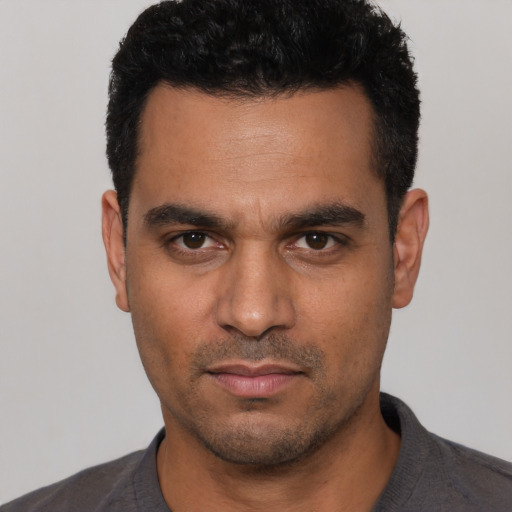 Neutral white young-adult male with short  black hair and brown eyes
