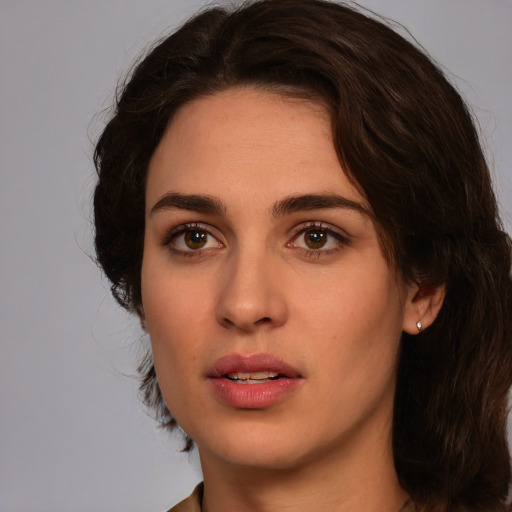 Neutral white young-adult female with medium  brown hair and green eyes