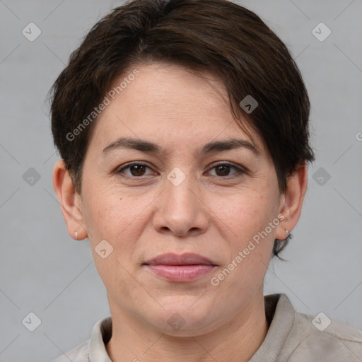 Joyful white adult female with short  brown hair and brown eyes