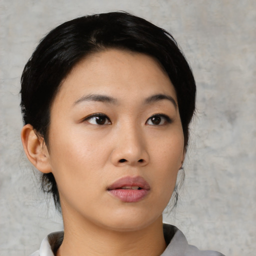 Neutral asian young-adult female with medium  black hair and brown eyes
