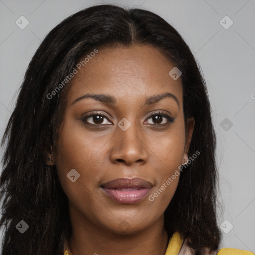 Joyful black young-adult female with long  brown hair and brown eyes