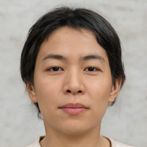 Neutral asian young-adult male with short  brown hair and brown eyes