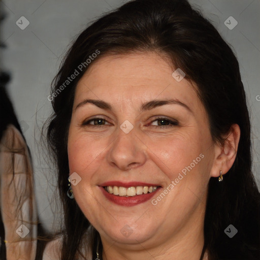 Joyful white adult female with long  brown hair and brown eyes