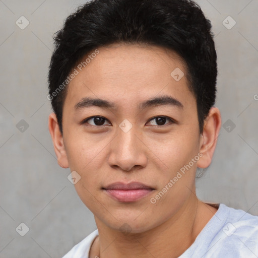 Joyful asian young-adult male with short  black hair and brown eyes