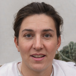 Joyful white adult female with short  brown hair and brown eyes