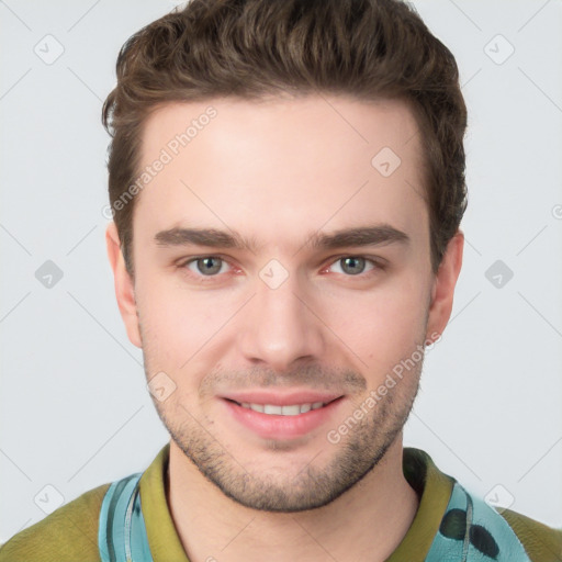 Joyful white young-adult male with short  brown hair and grey eyes