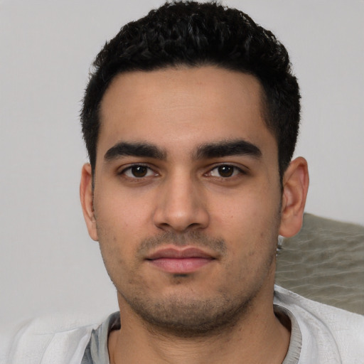 Neutral latino young-adult male with short  black hair and brown eyes