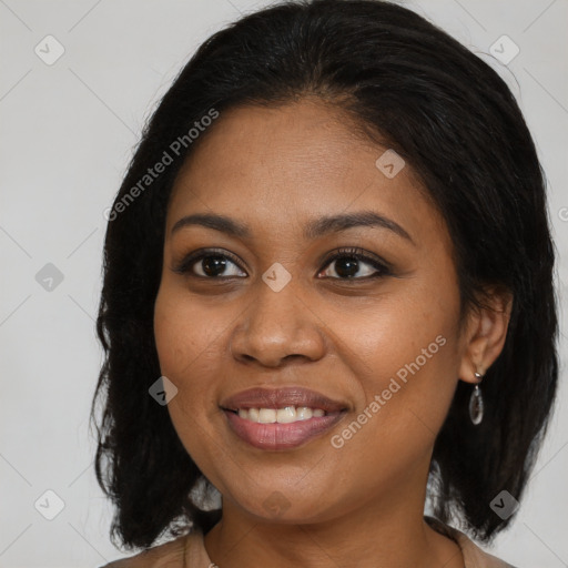 Joyful black young-adult female with medium  brown hair and brown eyes