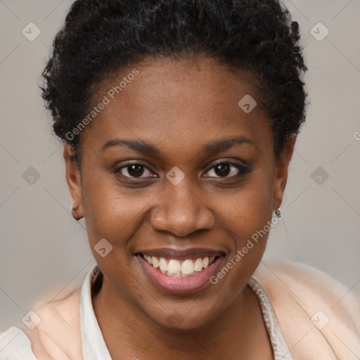 Joyful black young-adult female with short  brown hair and brown eyes