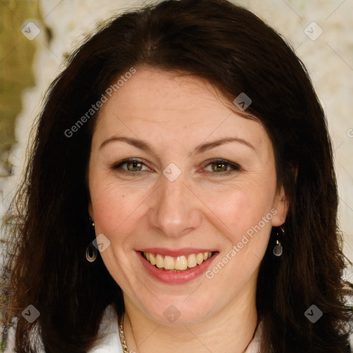 Joyful white adult female with long  brown hair and brown eyes