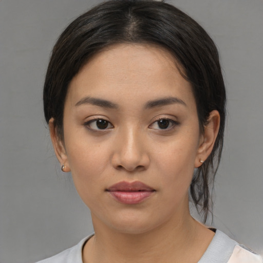 Neutral asian young-adult female with medium  black hair and brown eyes