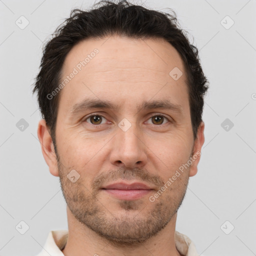 Joyful white adult male with short  brown hair and brown eyes