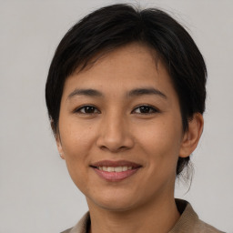 Joyful asian young-adult female with short  brown hair and brown eyes