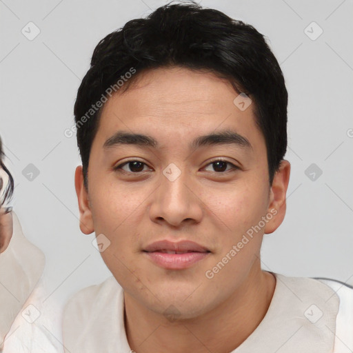 Joyful white young-adult male with short  black hair and brown eyes