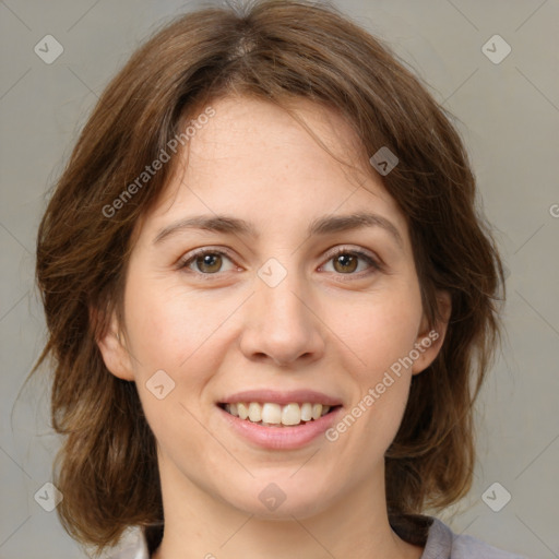 Joyful white young-adult female with medium  brown hair and green eyes