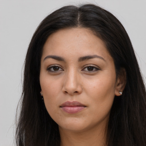 Neutral latino young-adult female with long  brown hair and brown eyes