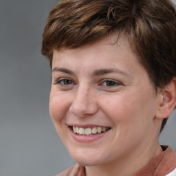 Joyful white young-adult female with short  brown hair and brown eyes