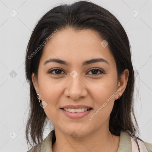 Joyful latino young-adult female with medium  brown hair and brown eyes