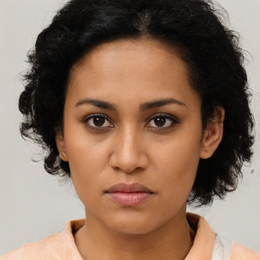 Neutral latino young-adult female with medium  brown hair and brown eyes