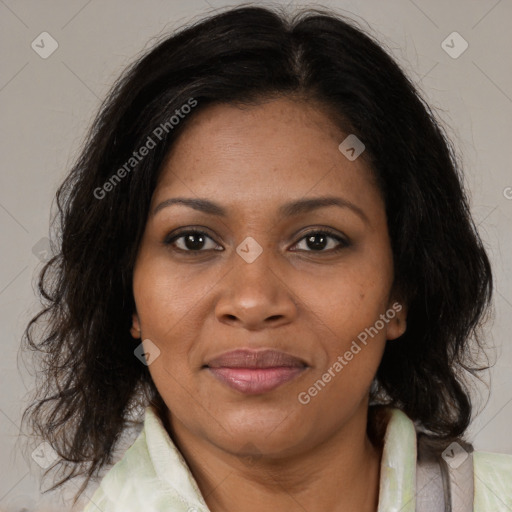 Joyful black adult female with medium  brown hair and brown eyes
