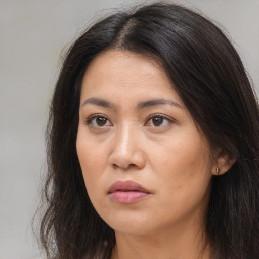 Neutral asian young-adult female with long  brown hair and brown eyes