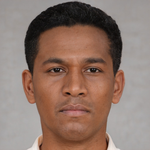 Neutral latino young-adult male with short  brown hair and brown eyes