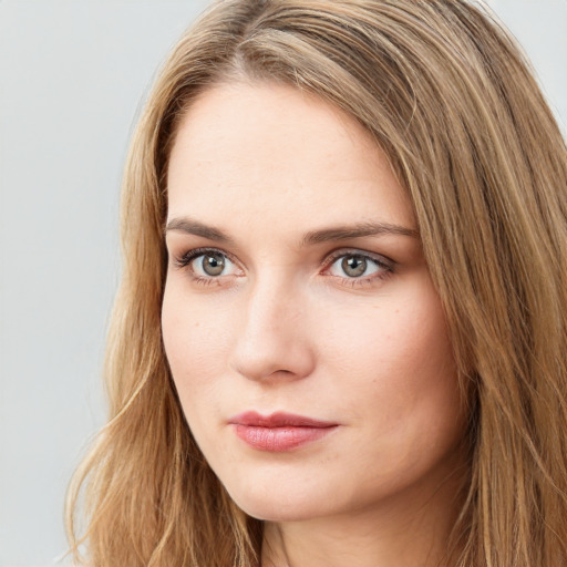 Neutral white young-adult female with long  brown hair and green eyes