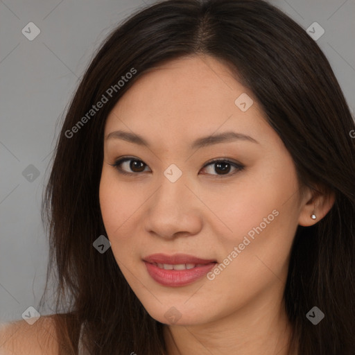 Joyful asian young-adult female with long  brown hair and brown eyes