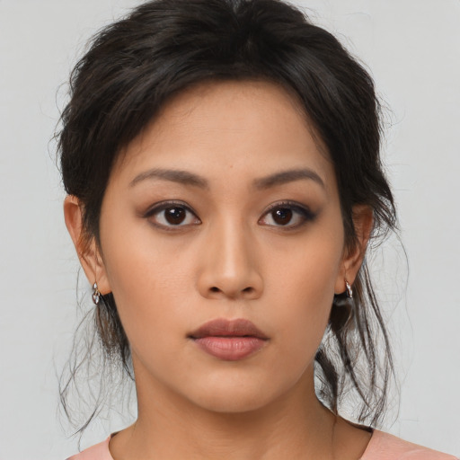 Neutral asian young-adult female with medium  brown hair and brown eyes