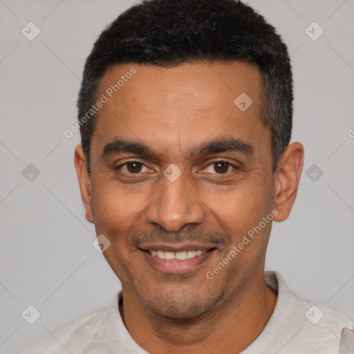 Joyful latino adult male with short  black hair and brown eyes