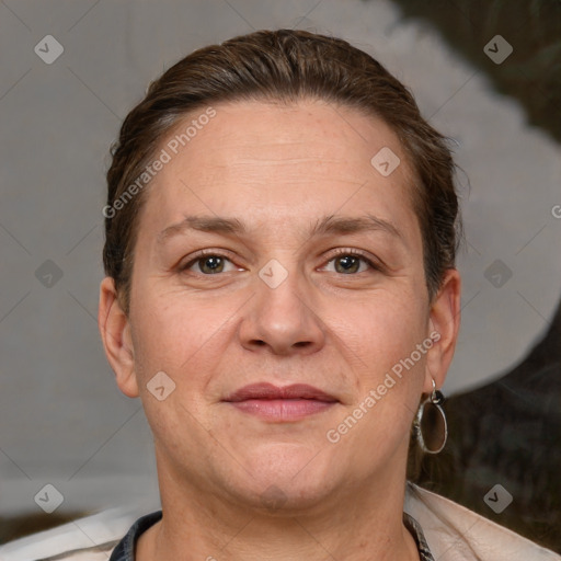 Joyful white adult female with short  brown hair and brown eyes