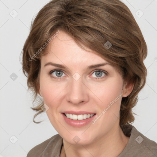 Joyful white young-adult female with medium  brown hair and blue eyes