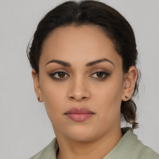 Neutral latino young-adult female with short  brown hair and brown eyes