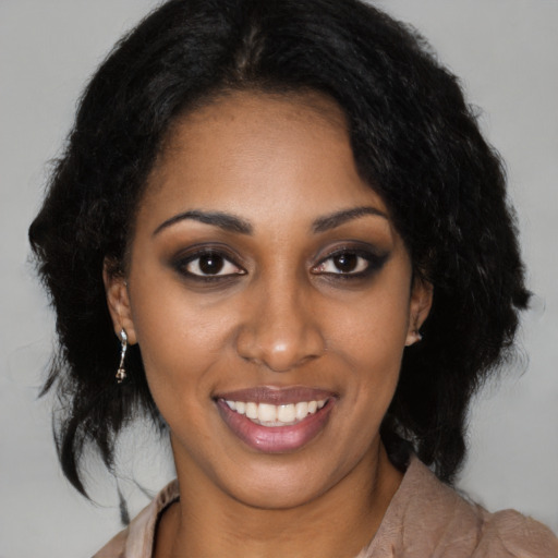 Joyful latino young-adult female with medium  black hair and brown eyes