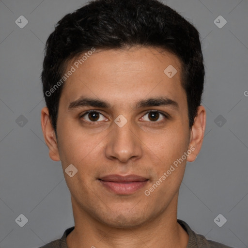 Joyful white young-adult male with short  black hair and brown eyes