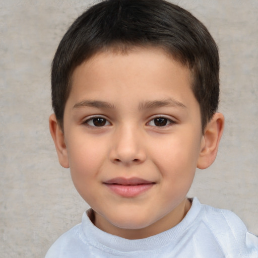 Joyful white child male with short  brown hair and brown eyes