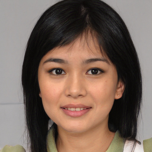 Joyful asian young-adult female with medium  black hair and brown eyes