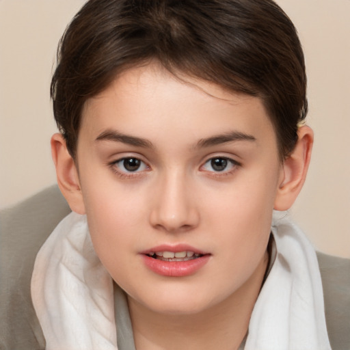 Joyful white child female with short  brown hair and brown eyes