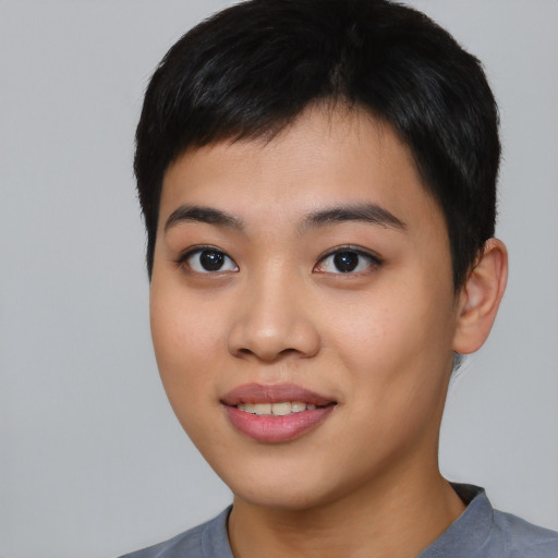 Joyful asian young-adult female with short  black hair and brown eyes