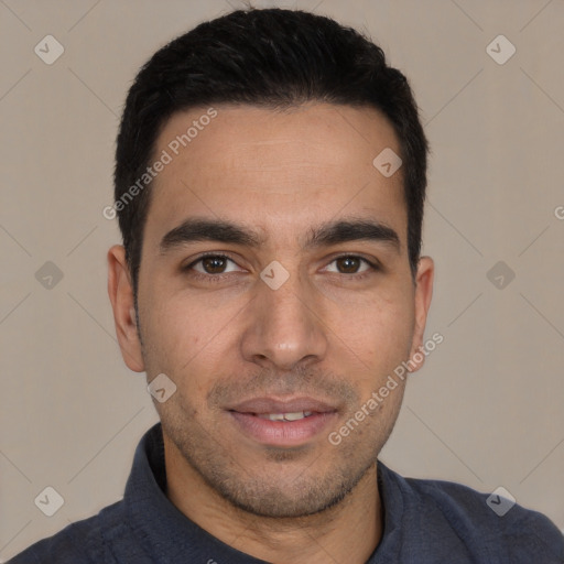 Joyful white young-adult male with short  black hair and brown eyes