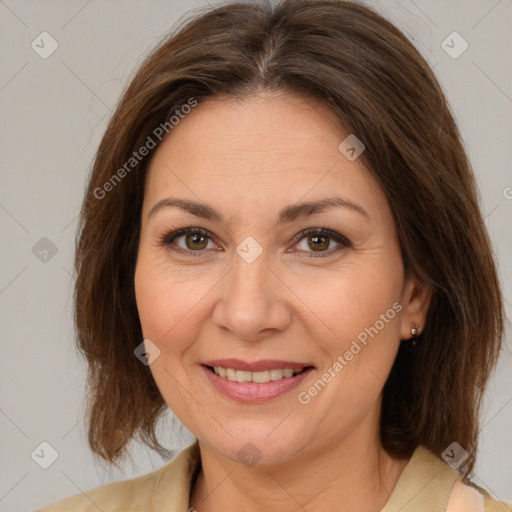 Joyful white adult female with medium  brown hair and brown eyes