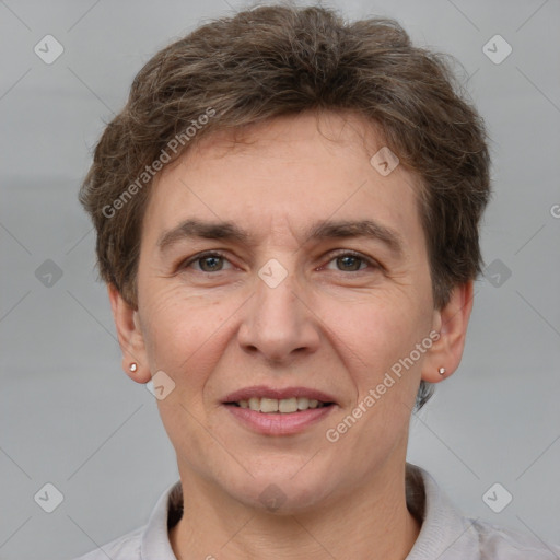 Joyful white adult male with short  brown hair and grey eyes