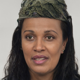 Joyful white adult female with long  brown hair and brown eyes