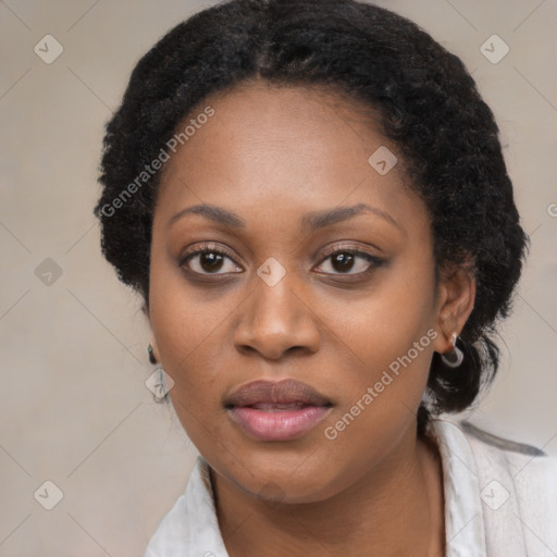 Joyful black young-adult female with medium  black hair and brown eyes