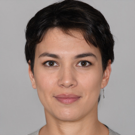 Joyful white young-adult female with short  black hair and brown eyes